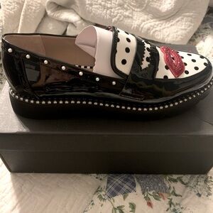 Adorable Betsey Johnson loafer. Black and white with red lips.